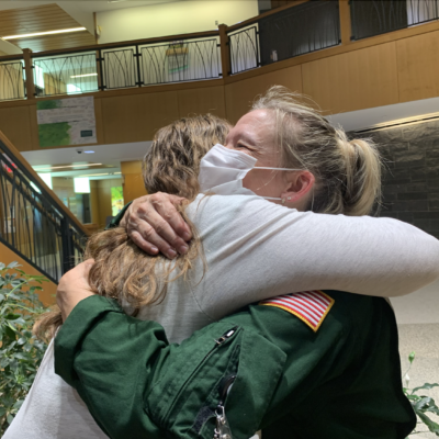 Missy McCann and Jenn Popper share a hug