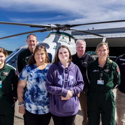 Megan and Kyra day flanked by LifeFlight crew and founder Tom Judge at the Bangor Base, Photo by Ashley L. Conti