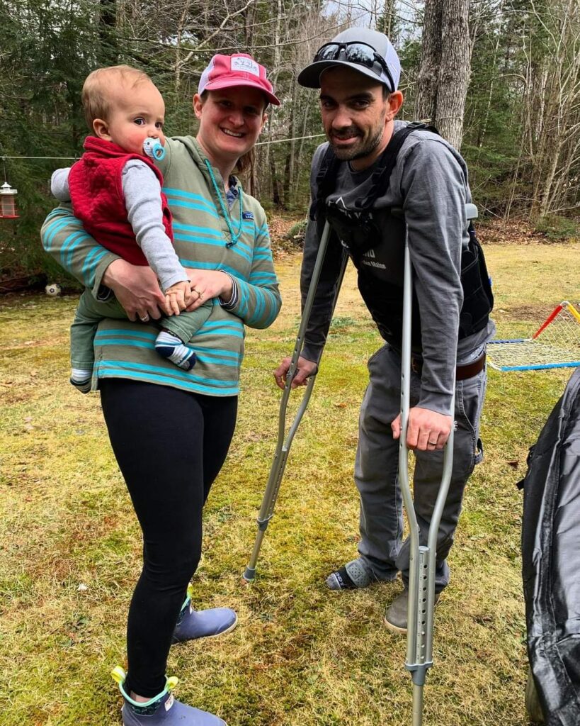 Cote Hadlock on crutches with family