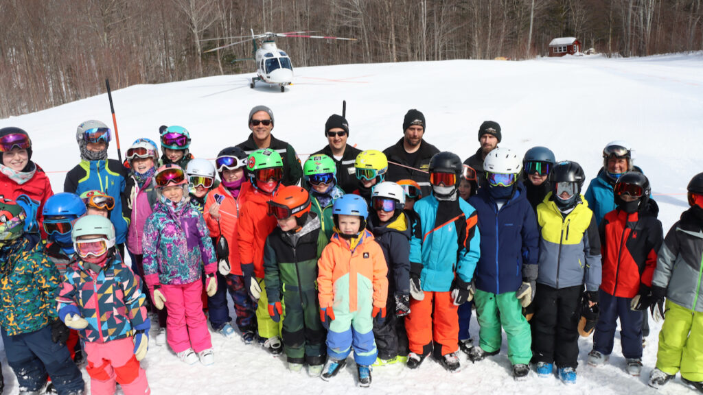 Lifeflight crew members with kids at Sunday Mountain Ski Resort in March 2023