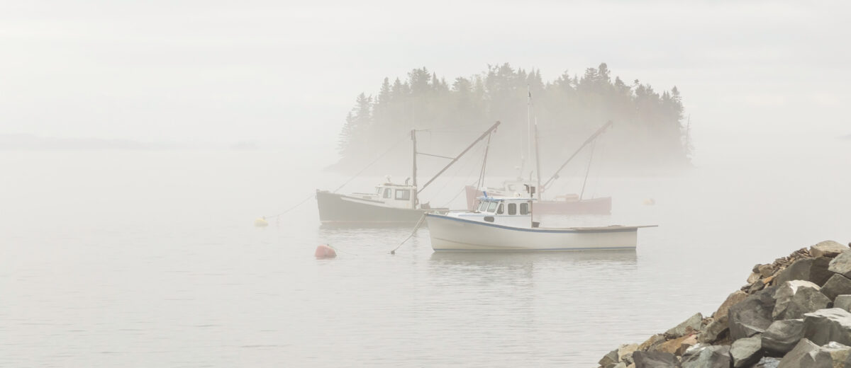Fishing boats in heavy fog