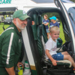 Rotor wing pilot Kirk Donovan with a young LifeFlight supporter.