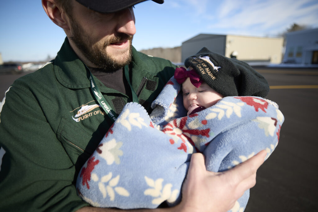 LifeFlight crew member holding baby