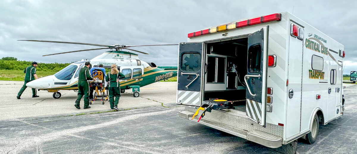 A LifeFlight crew transfers a patient from an ambulance to a LifeFlight helicopter