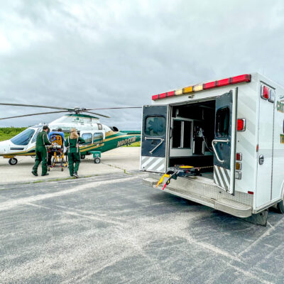 A LifeFlight crew transfers a patient from an ambulance to a LifeFlight helicopter