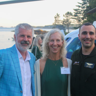 David Humm with his wife, Mary Humphrey, and a LifeFlight crew member at an event at their home in Pemaquid, July 2023.