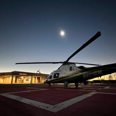 A LifeFlight helicopter sits on the helipad at Houlton Regional Hospital during the solar eclipse on April 8, 2024.
