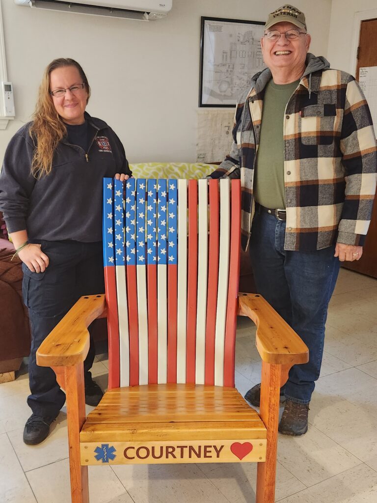 Bob Carr with Courtney Munger and the chair he built for her.