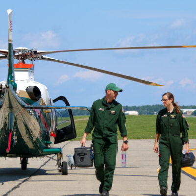 LifeFlight crew members next to a helicopter.